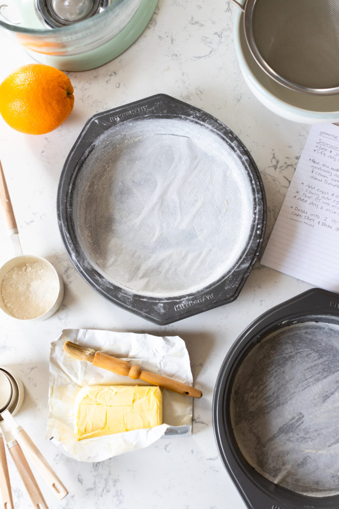 Greasing and flouring the cake pans