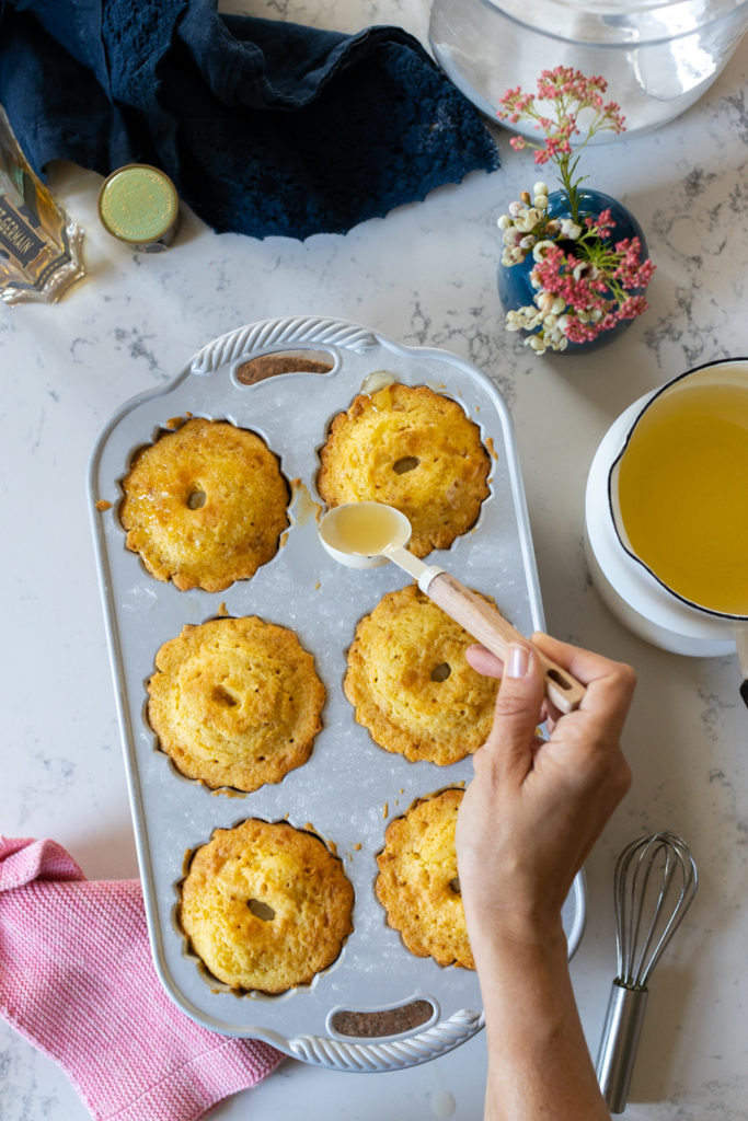 adding St. Germain glaze to bundtlettes