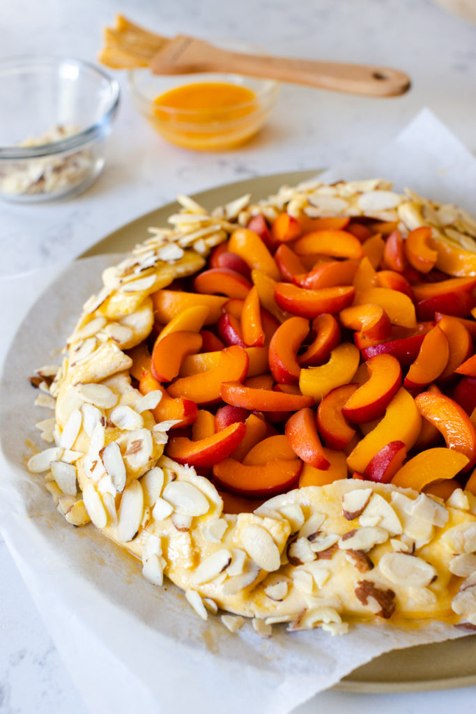 Adding almonds to the galette