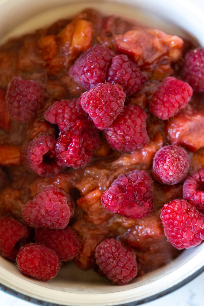 Adding raspberries to Rhubarb Ginger Compote
