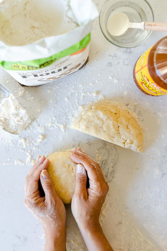 shaping the two halves into dough disks