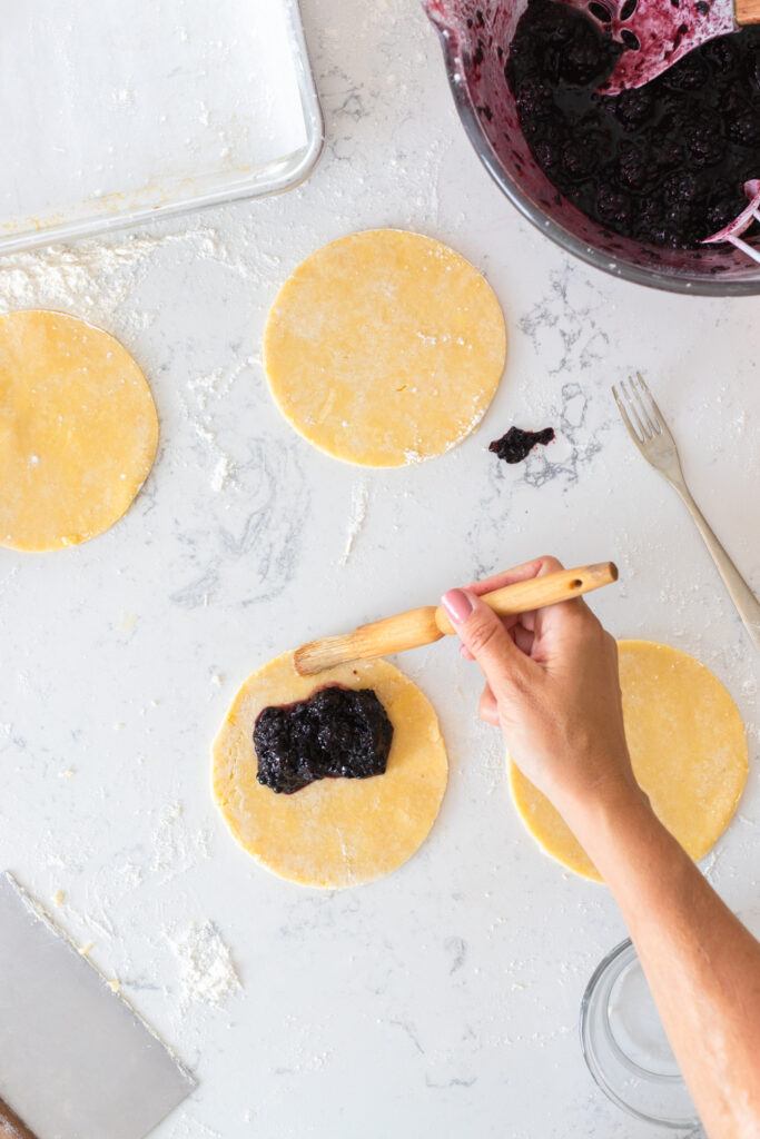 Brush edges with water.