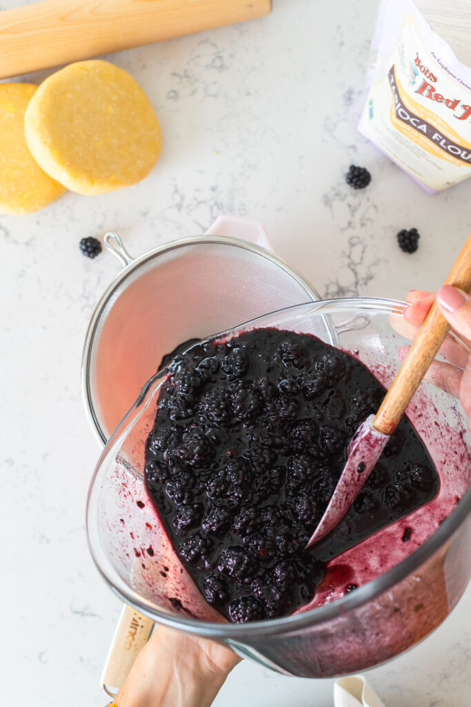 Straining Blackberry Lime Hand Pie filling