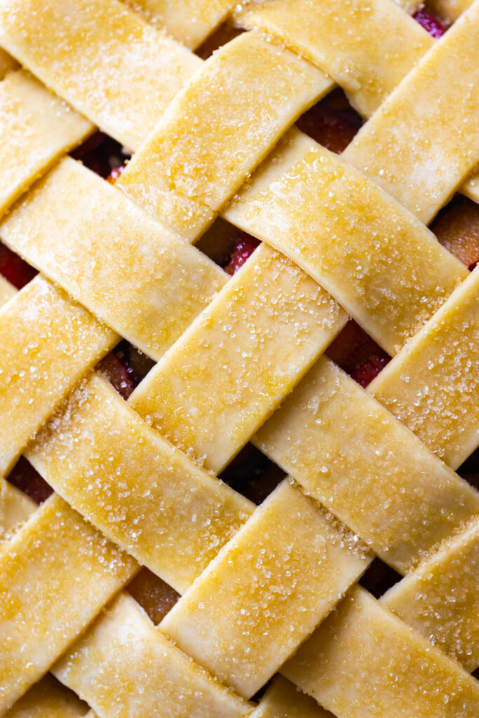 sprinkle pie with sugar before baking - a close up of lattice pie top