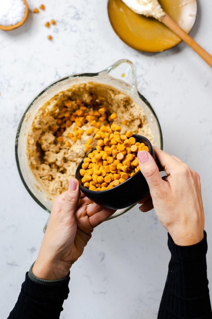 adding butterscotch chips to cookie dough