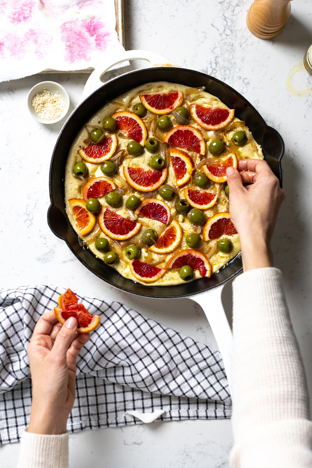 adding blood oranges to focaccia