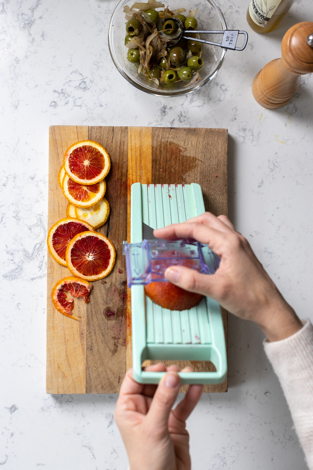slicing blood orange with a mandoline