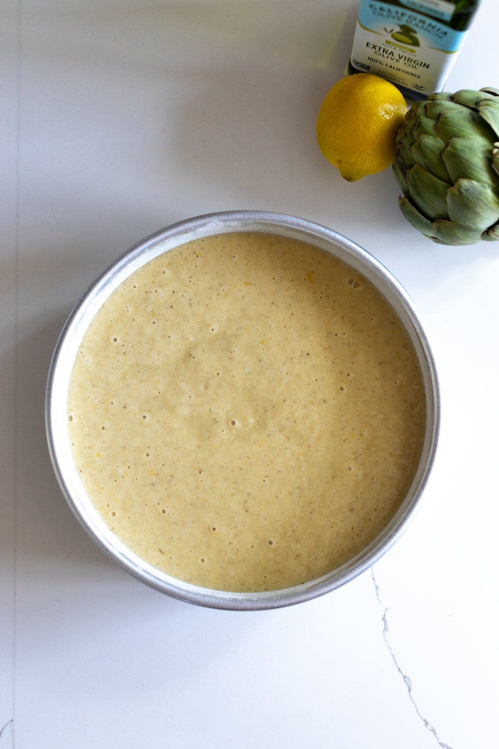 Artichoke Olive Oil Cake batter in pan