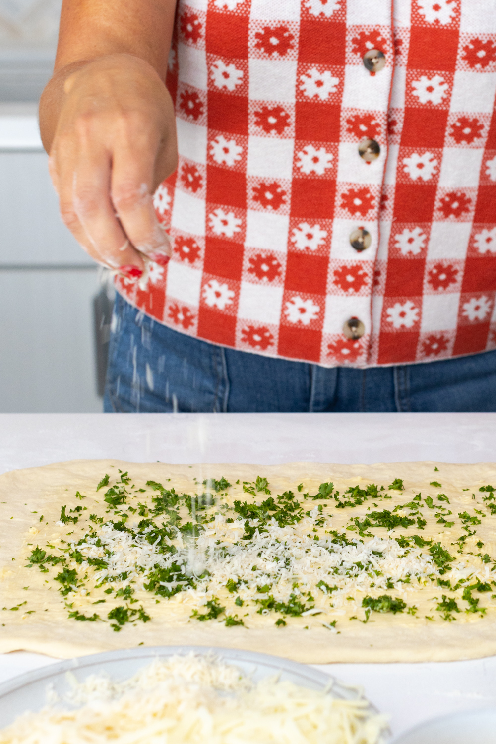 adding parsley to Stromboli dough
