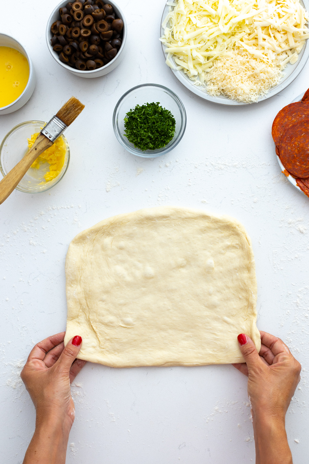 Shaping pizza dough in rectangle