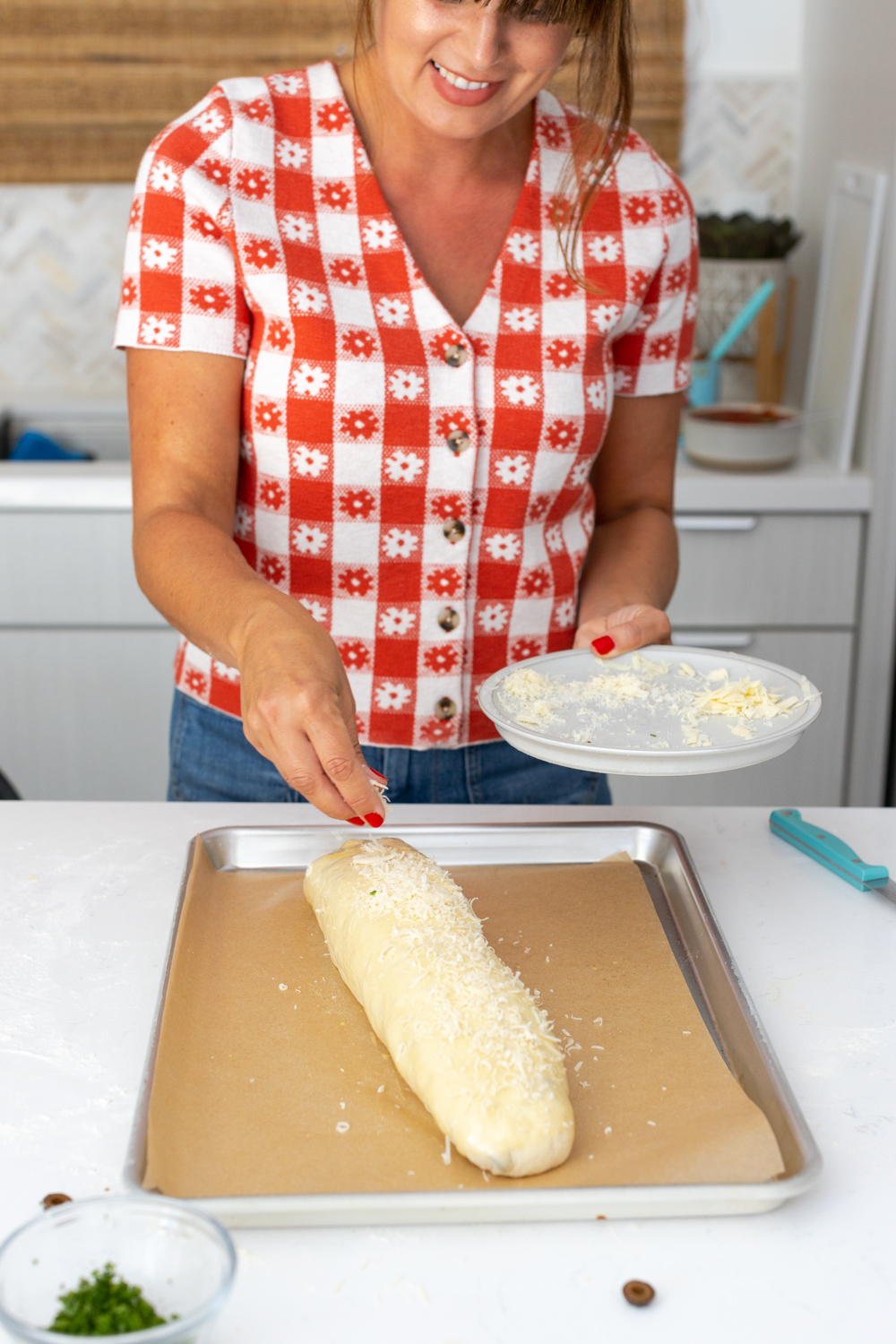 topping Stromboli with Parmesan