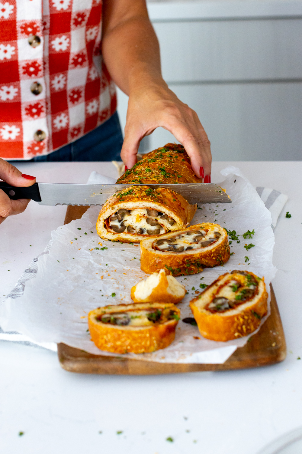 Slicing Pepperoni Black Olive Stromboli