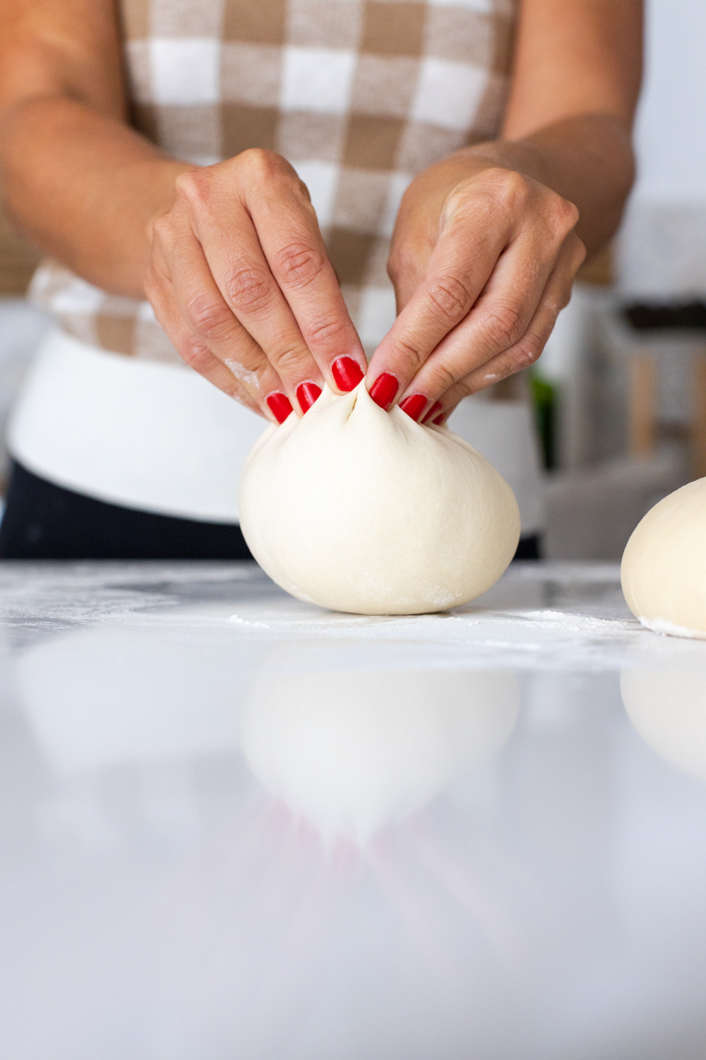 pinching pizza dough to seal