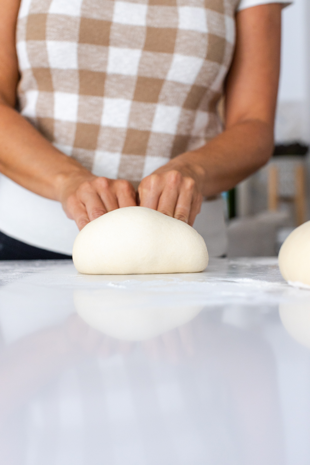 pressing pizza dough