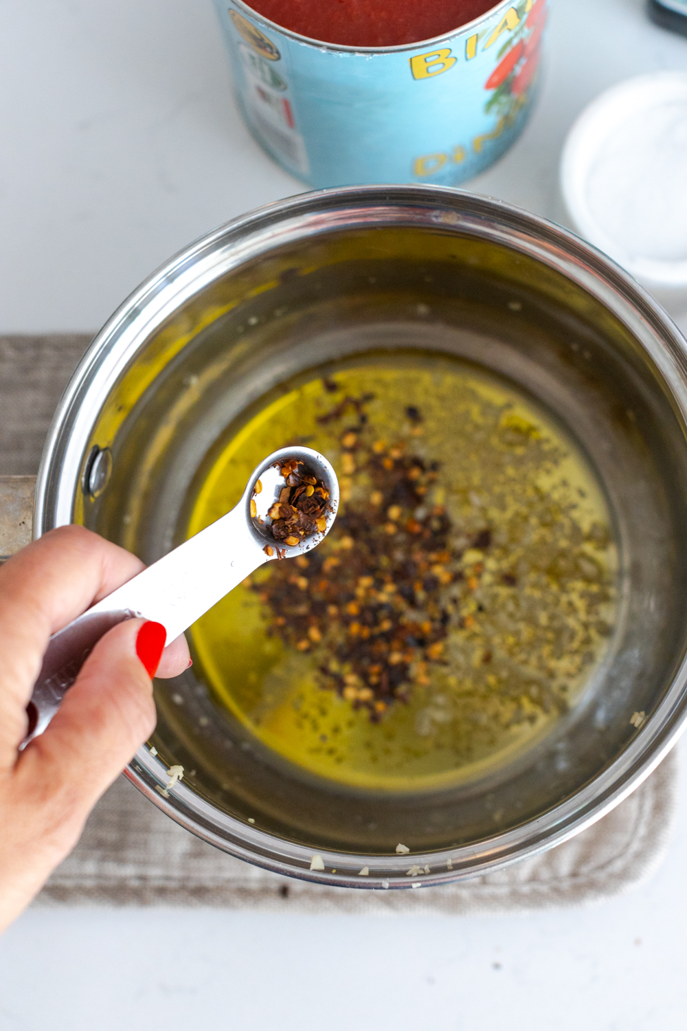 sautéing red pepper flakes with garlic and olive oil