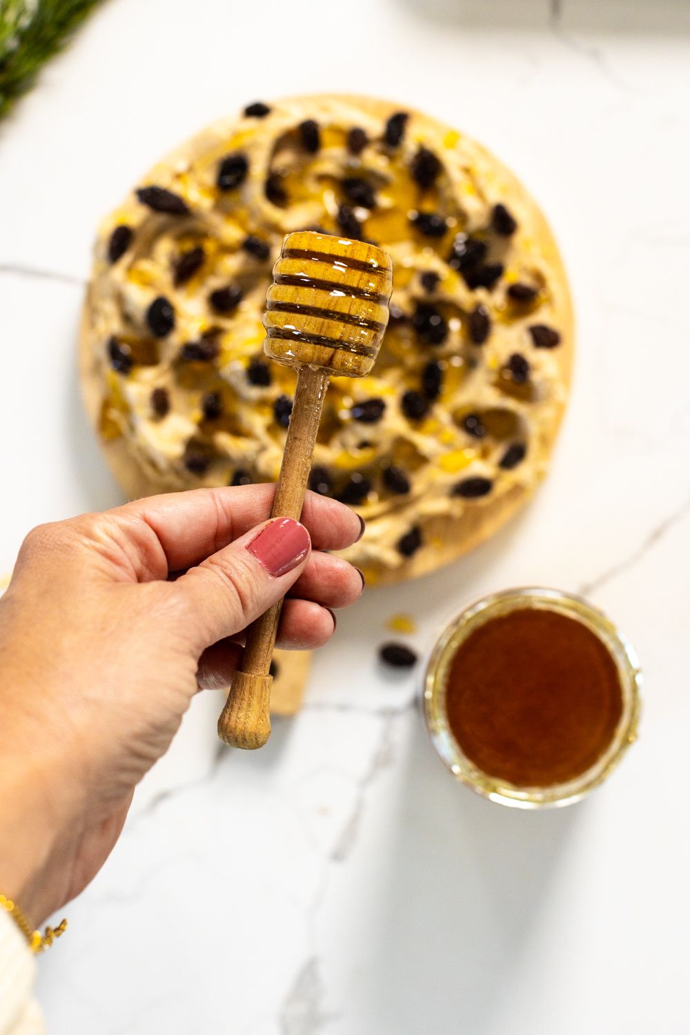 drizzling honey on butter board