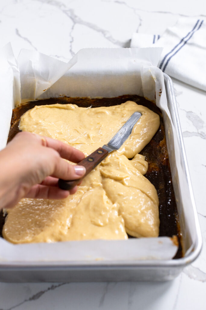 Step 3 is spreading the remaining coffee cake batter over the puree