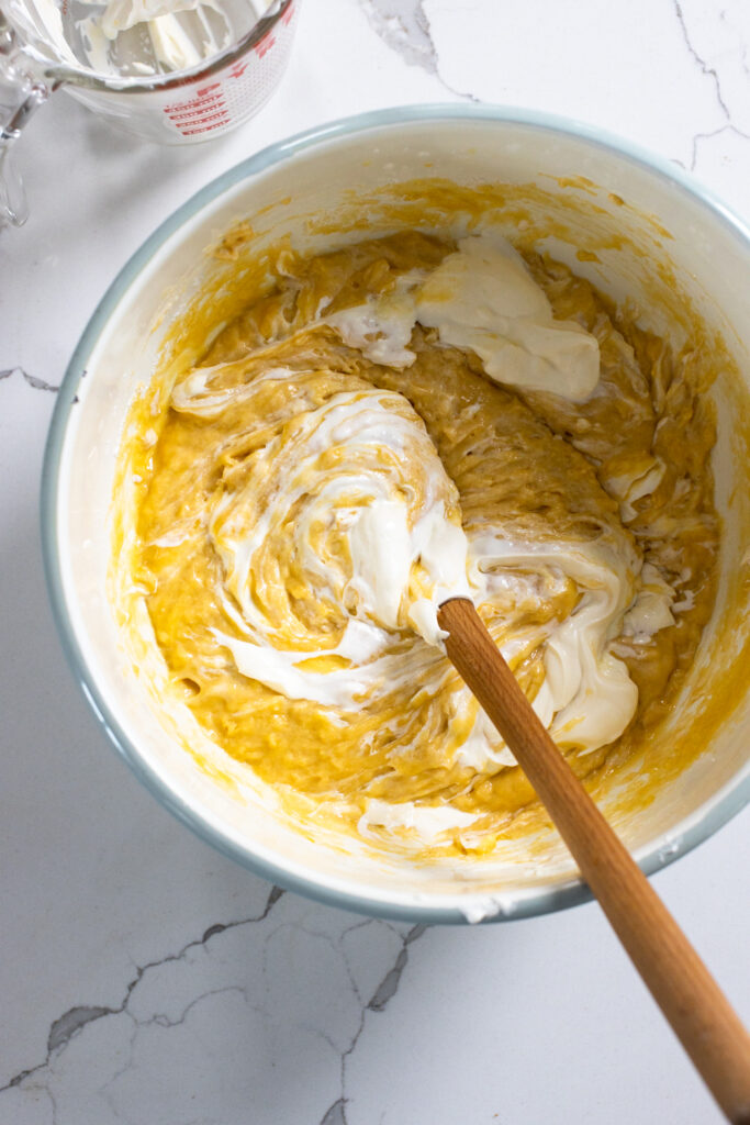 Folding sour cream into coffee cake batter