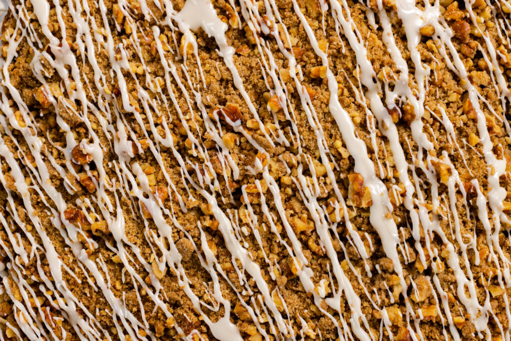 close up of Spiced Prune Coffee Cake drizzled with icing