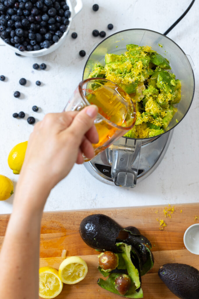 Combining avocado tart filling ingredients