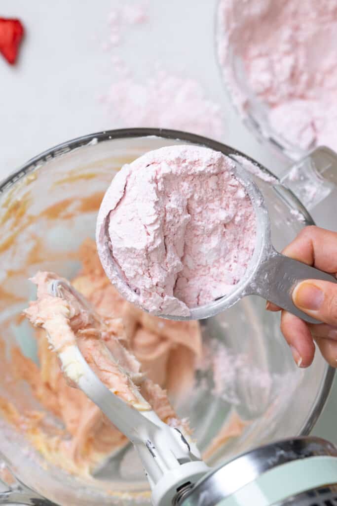 mixing freeze dried strawberry powder into frosting