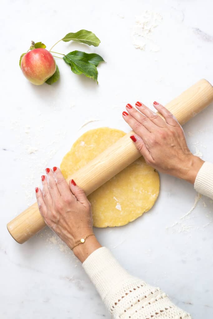 Rolling out cheddar pie dough