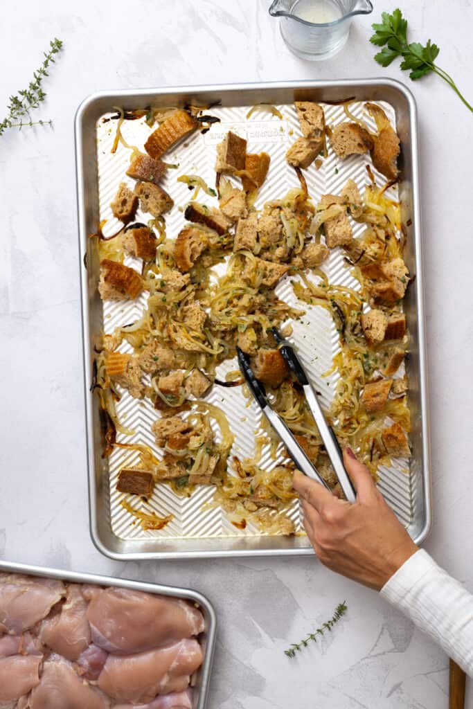 tossing French onions with bread and garlic butter