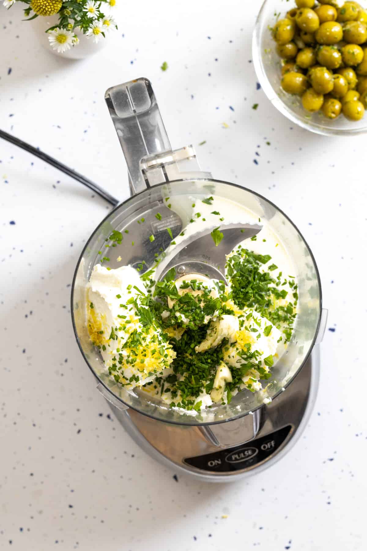 blending ingredients for herby goat cheese tartlet filling