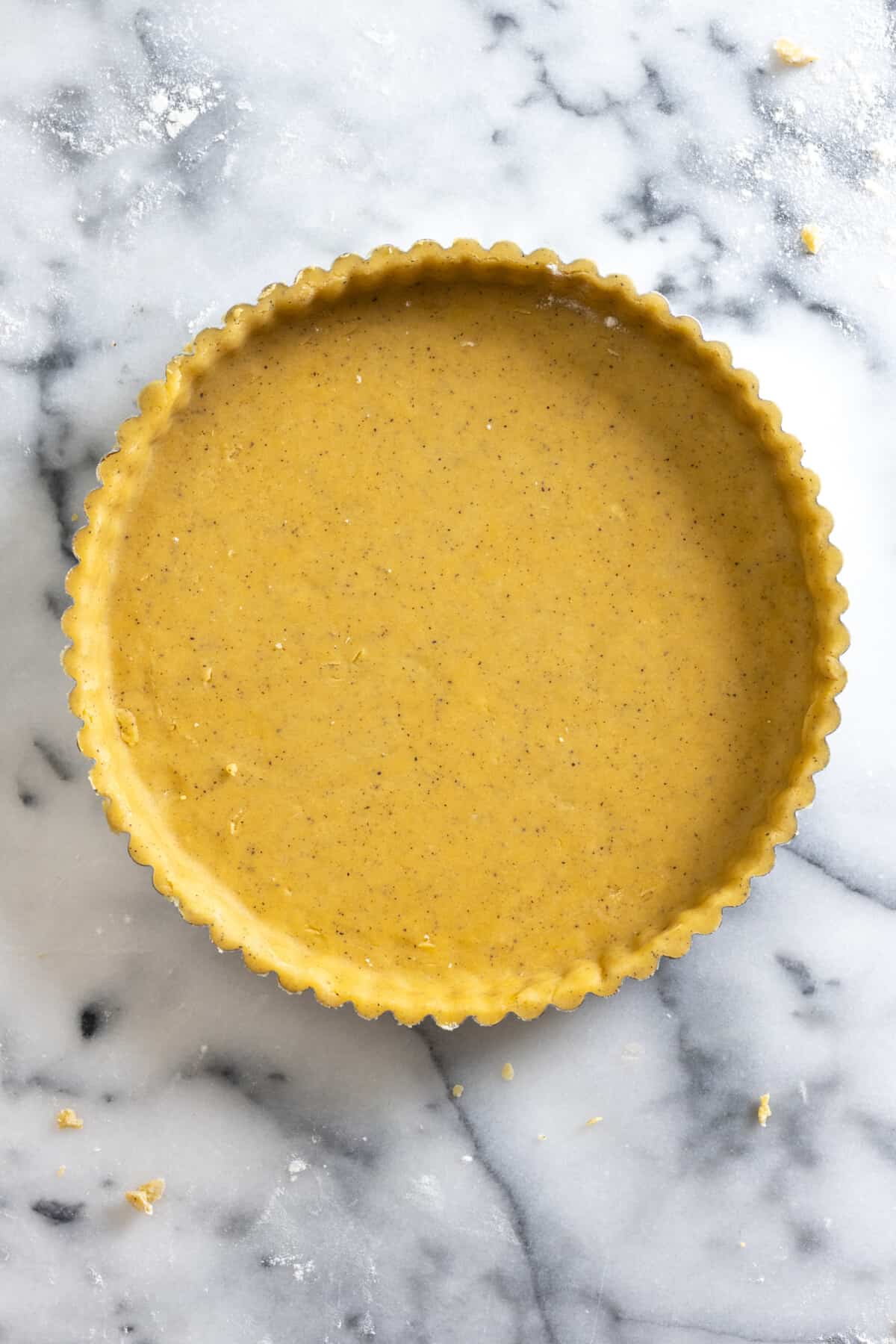 Rolled out tart dough in tart pan