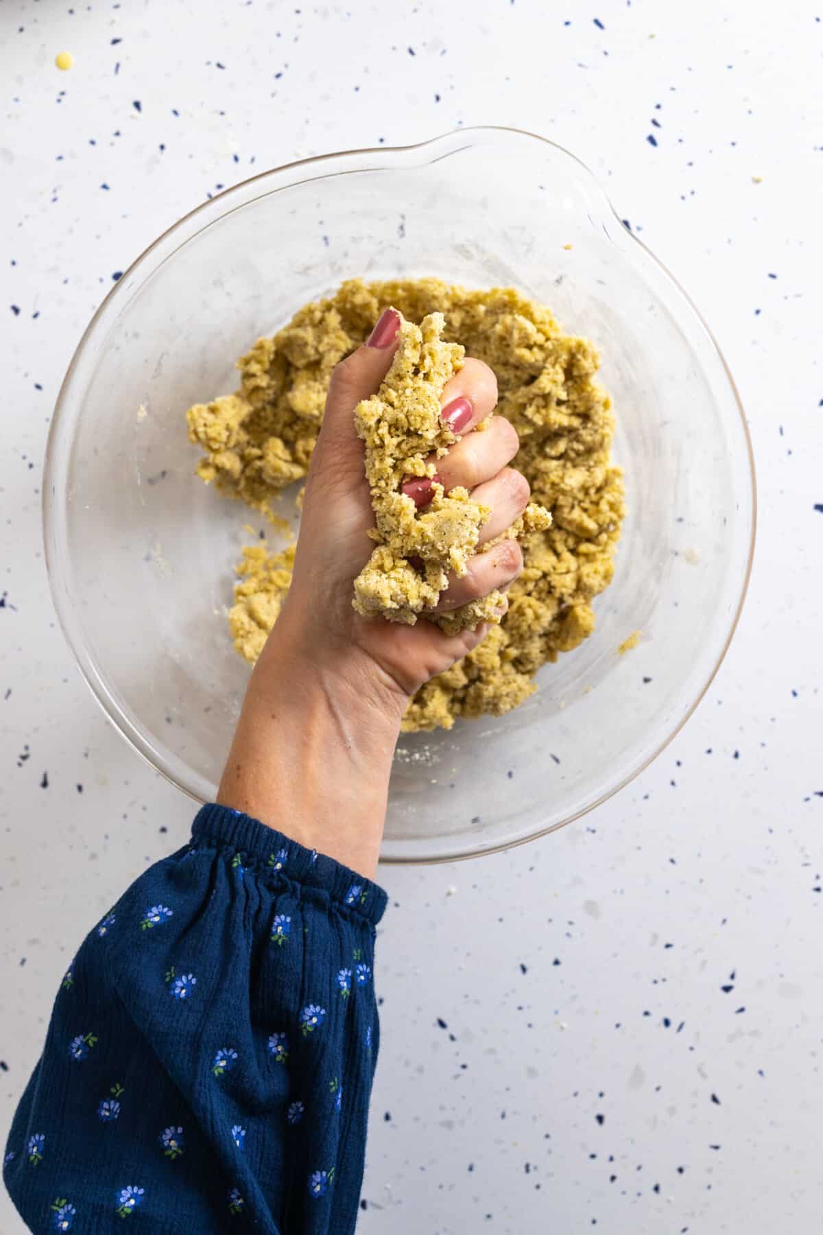 testing tart dough hydration by squeezing