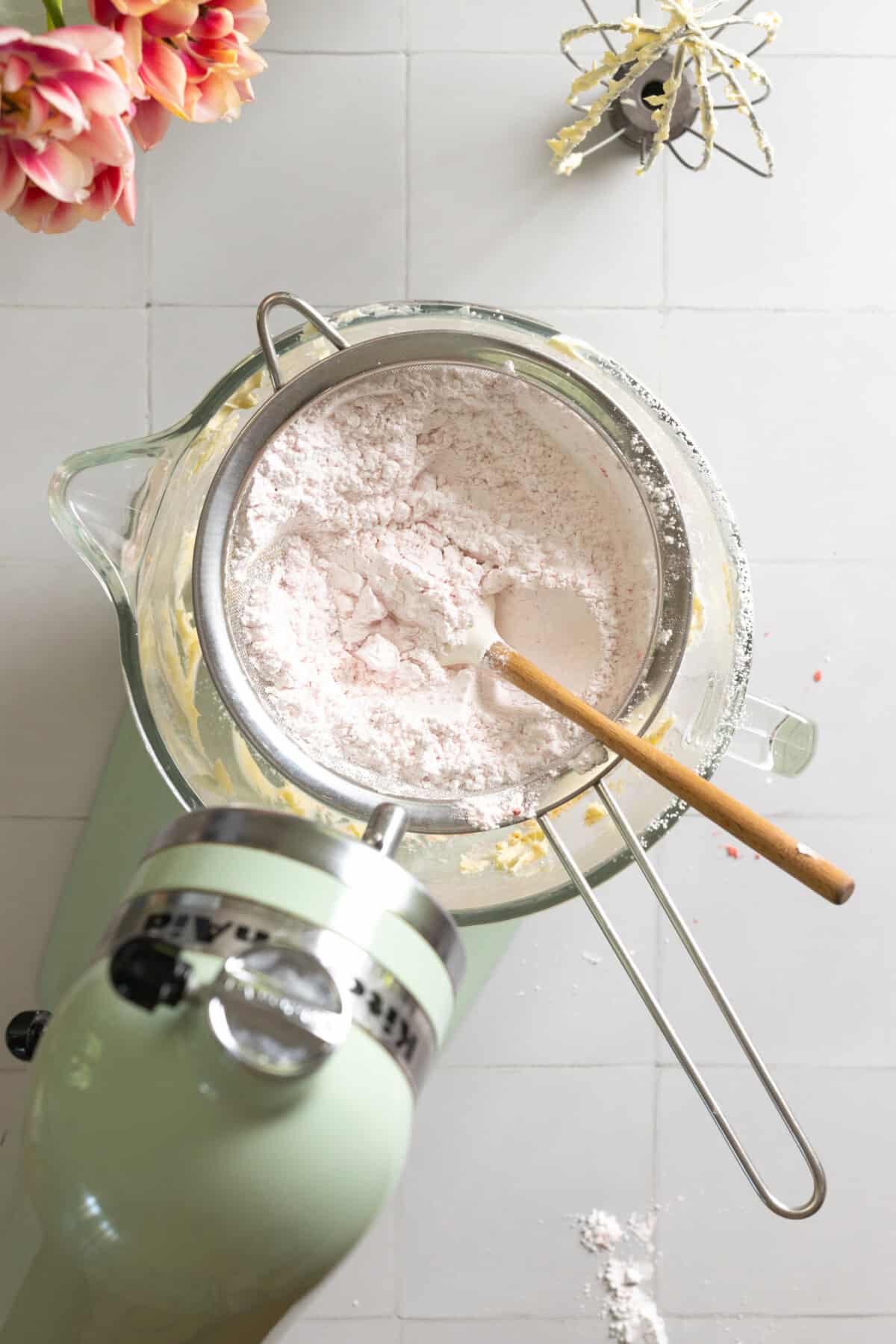 blending strawberry cream cheese frosting
