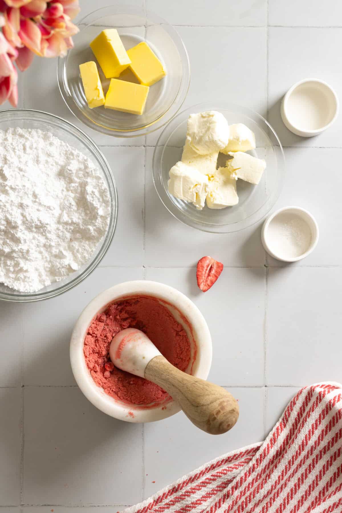 Crushing freeze dried strawberries with mortar and pestal