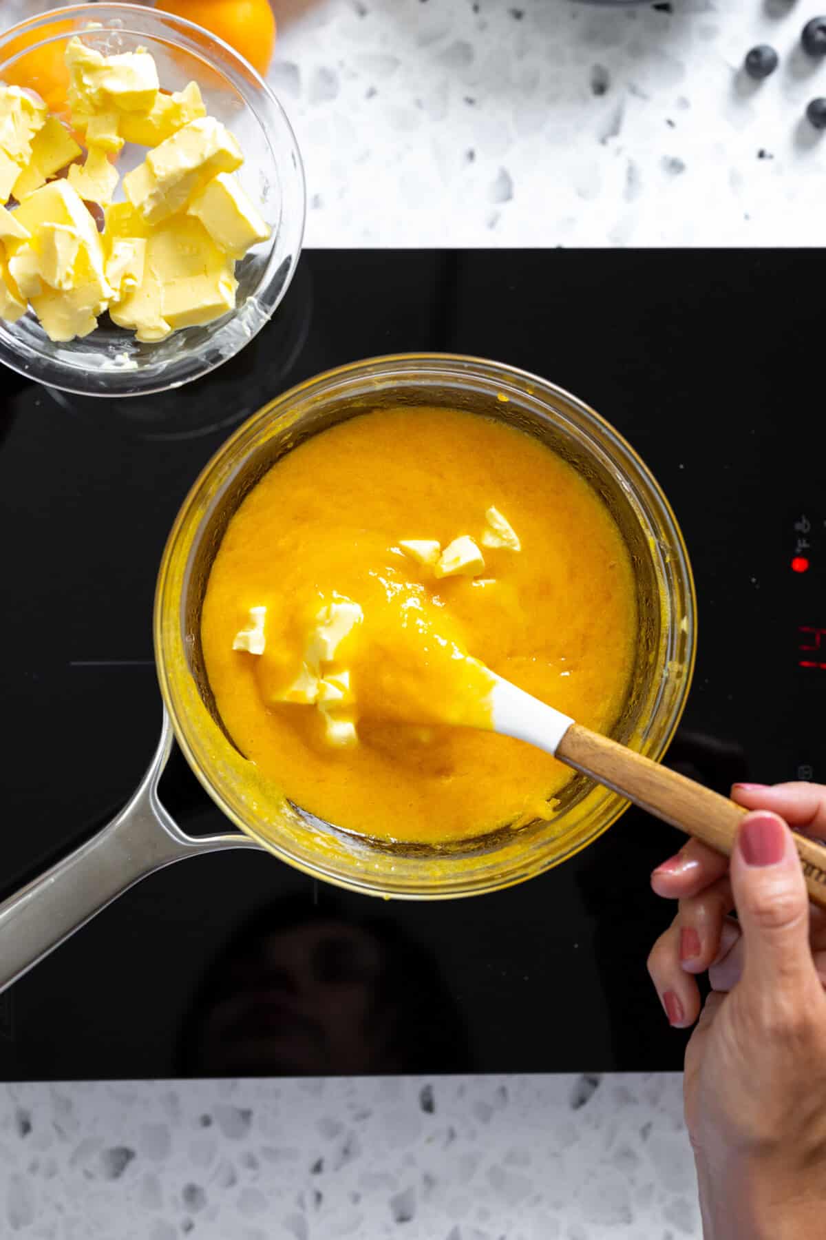adding butter to curd