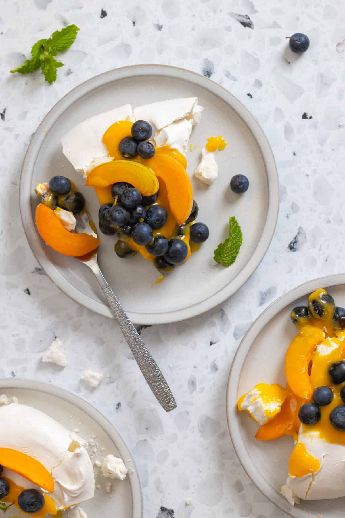A slice of Pavlova with Apricot Curd and Blueberries