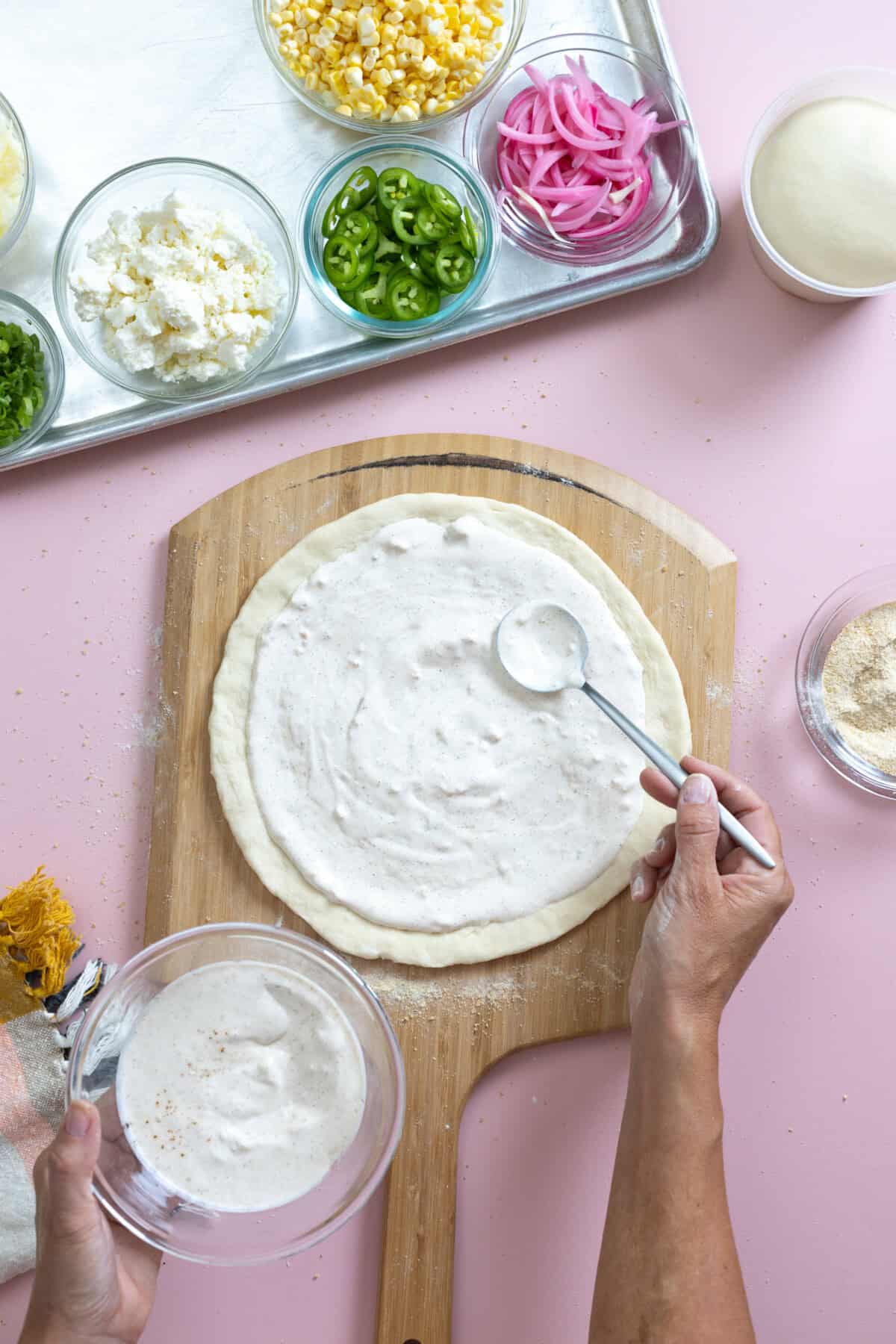 Adding Garlic Crema Sauce to stretched Quick and Easy Pizza Dough