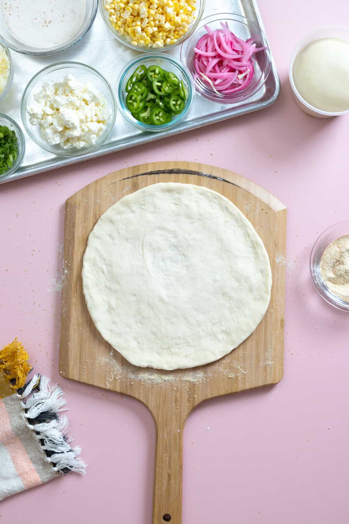Quick and Easy Pizza Dough ready to be topped!