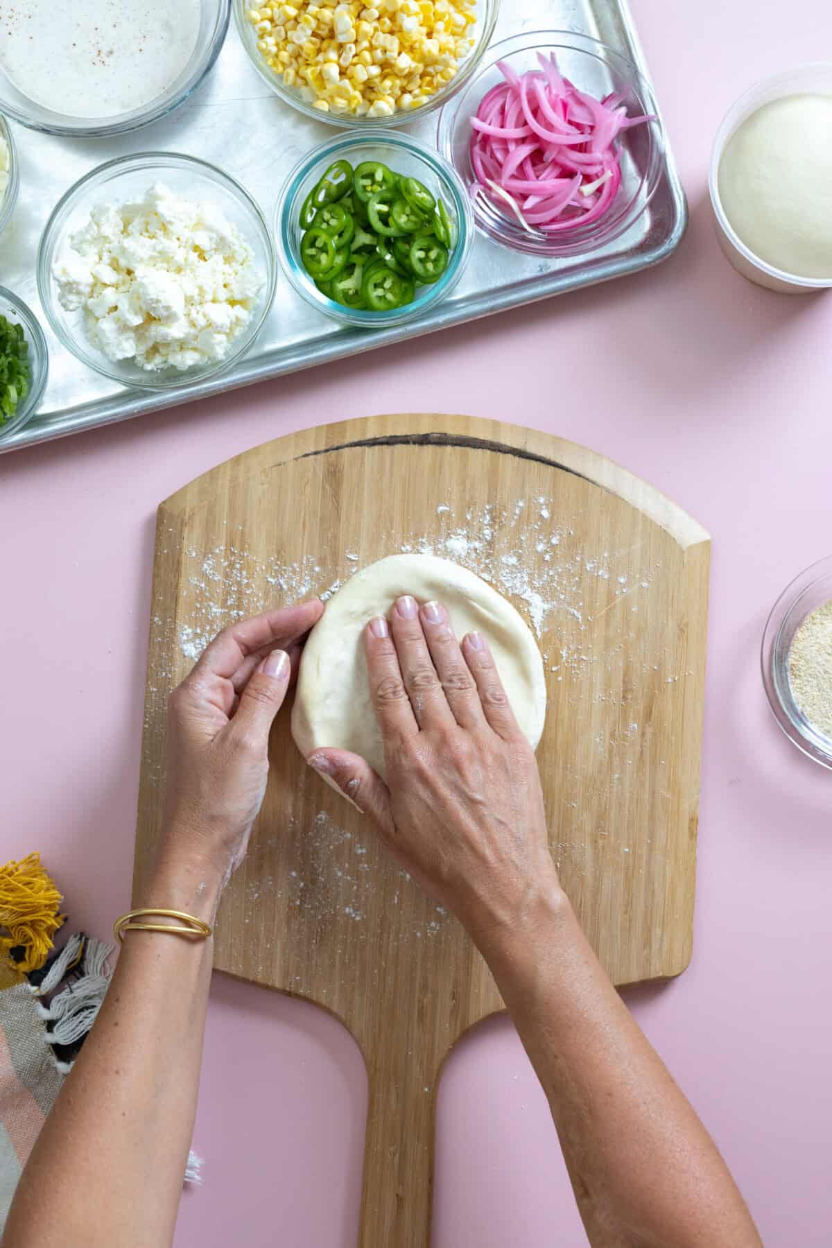 shaping pizza dough