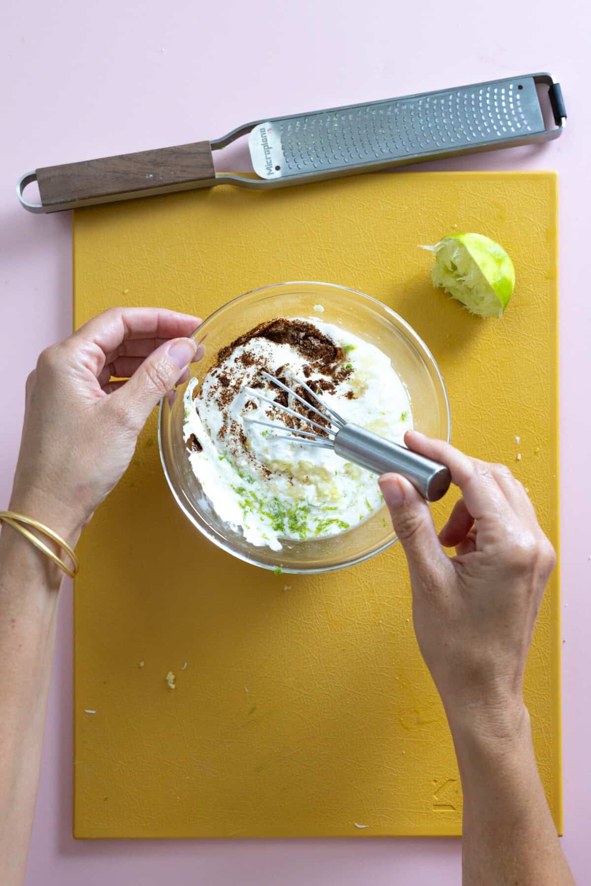mixing garlic crema sauce