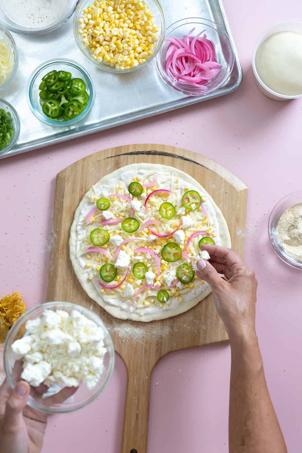 Crumble cotija cheese on pizza