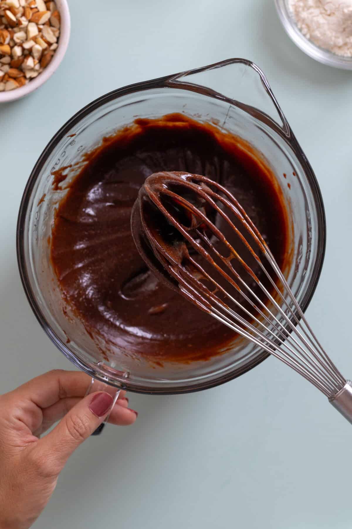 whisking brownie batter together