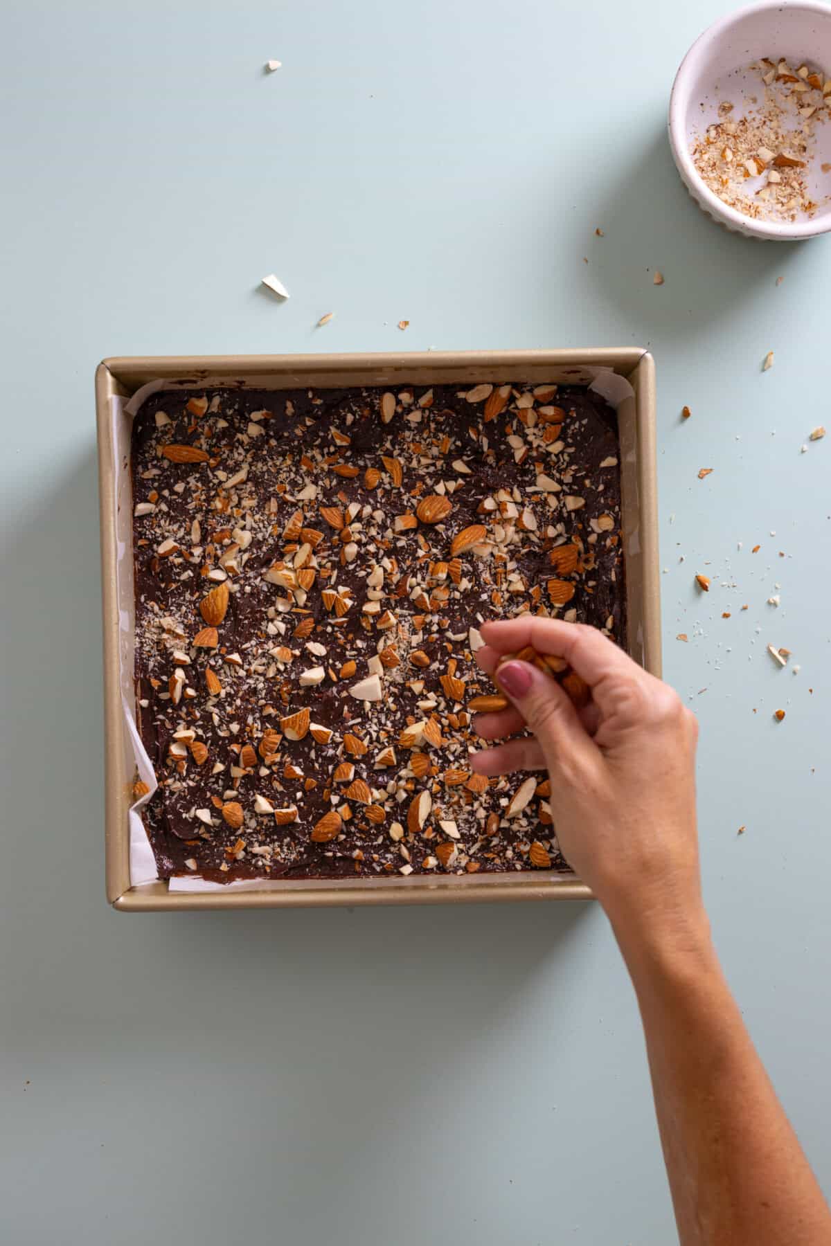 adding almonds to mocha brownie batter