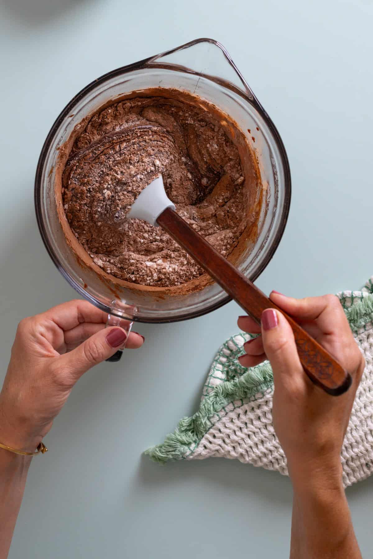 stirring dry ingredients into Mocha Almond Fudge Brownies