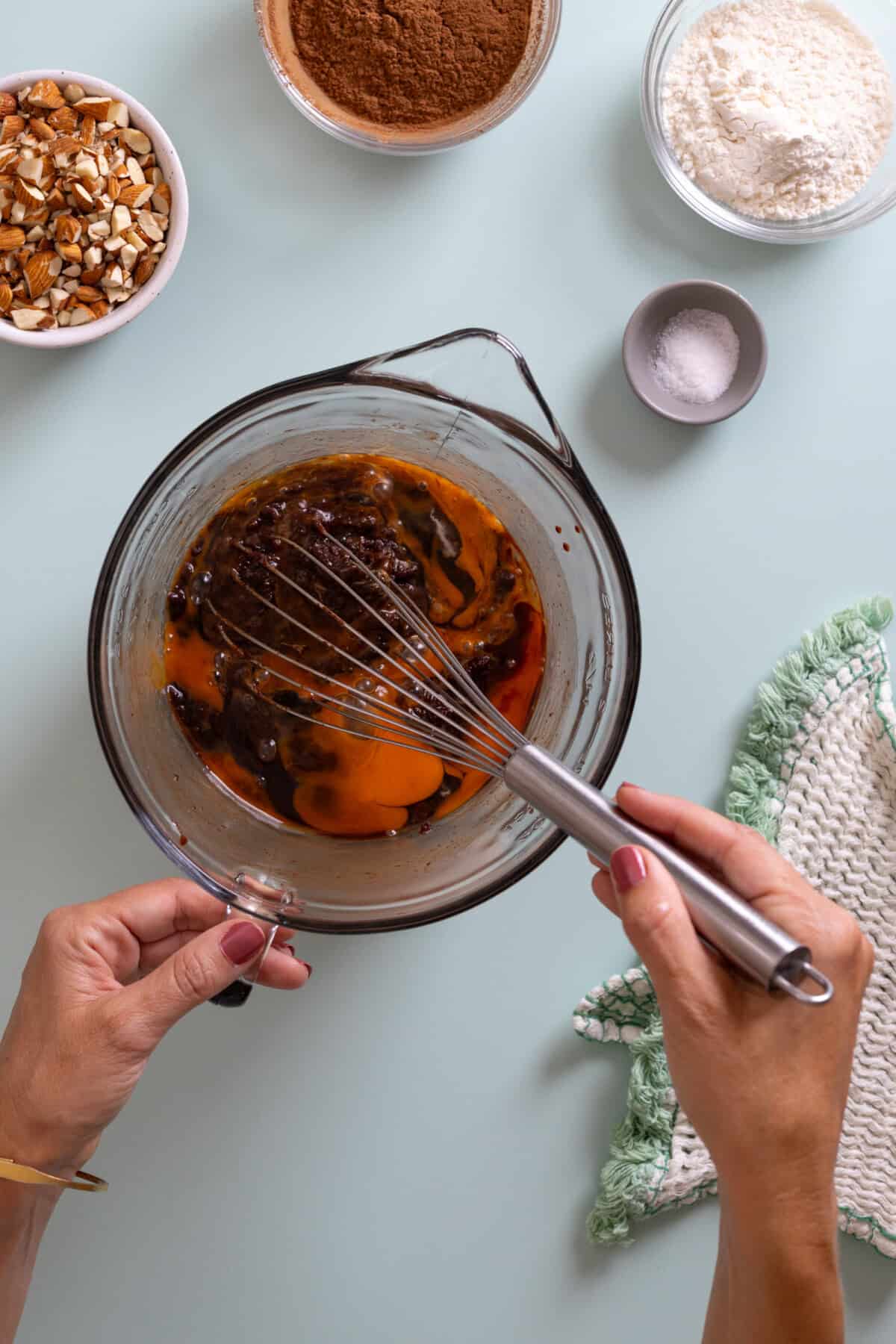 whisking eggs into brownie mix