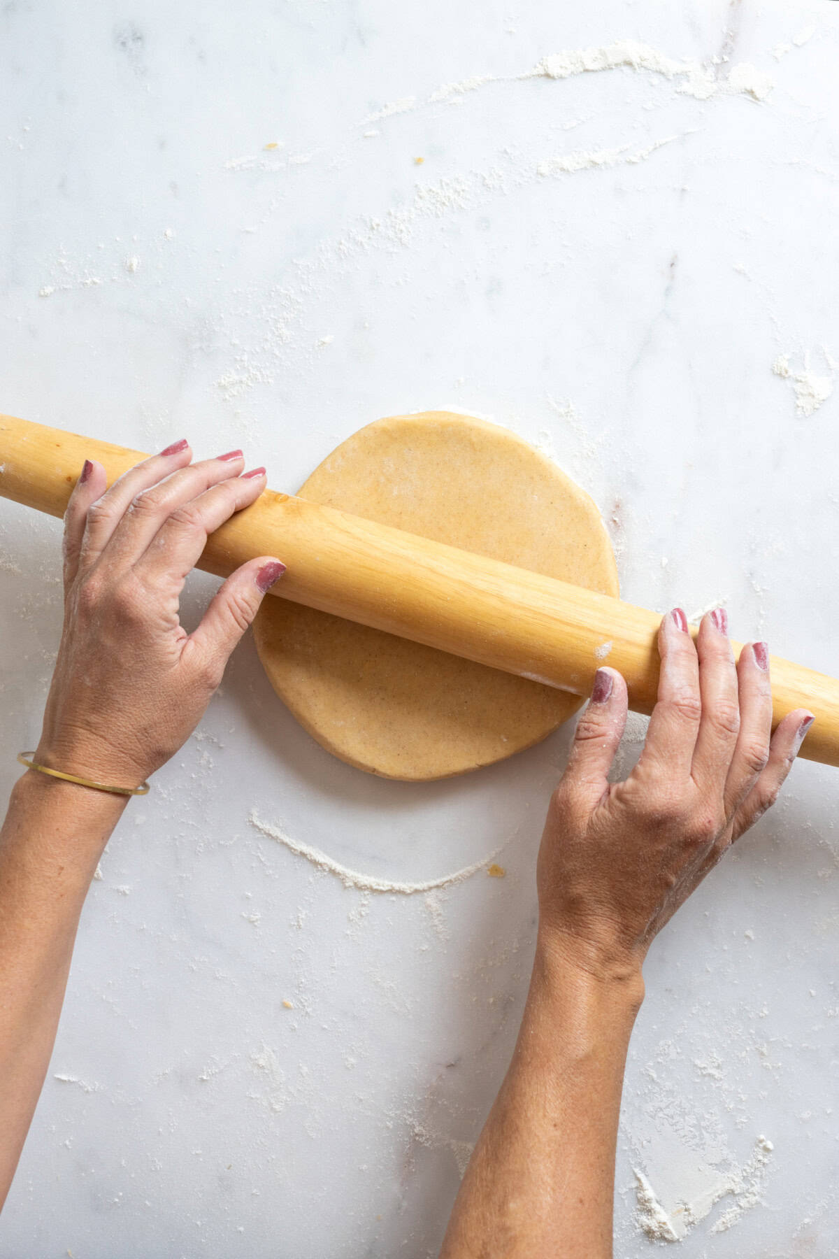 Roll out the dough evenly into ¼" thick round.