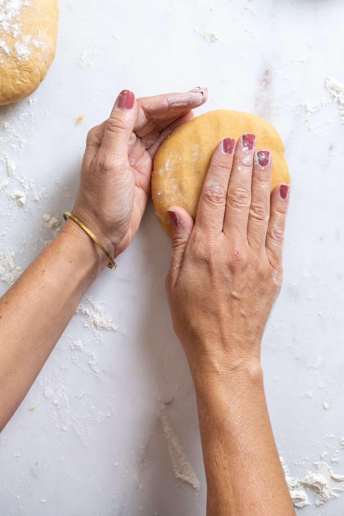 Pat the cookie dough into a disk to re-roll