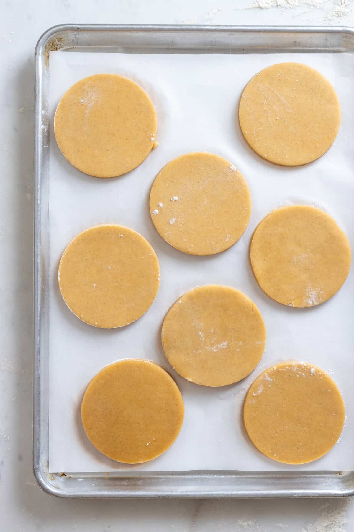 cookies stacked on baking sheet for chilling