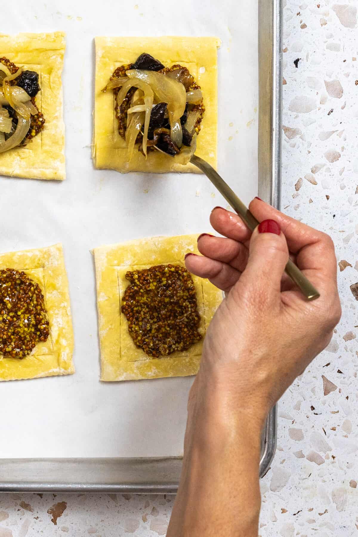 filling puff pastry with prune onion mixture