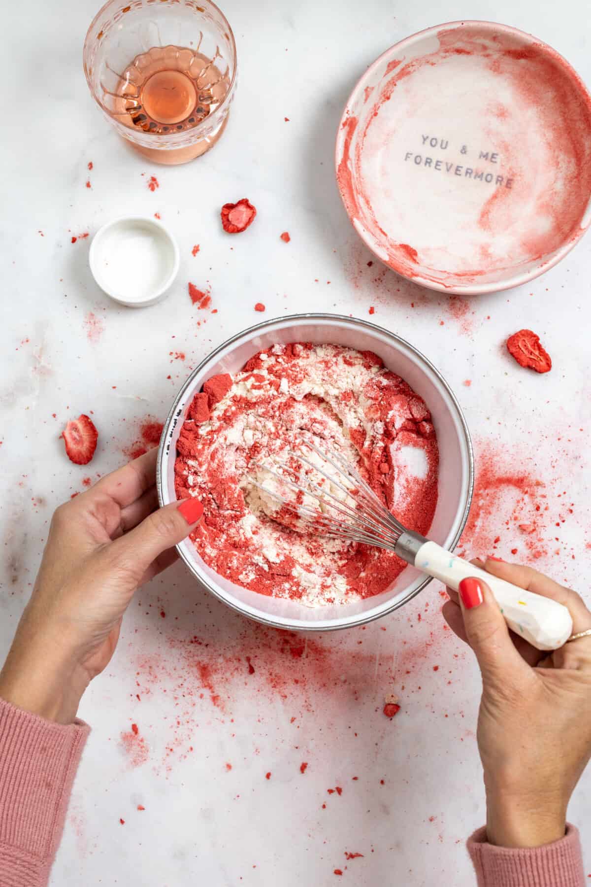 whisking in freeze dried strawberry powder