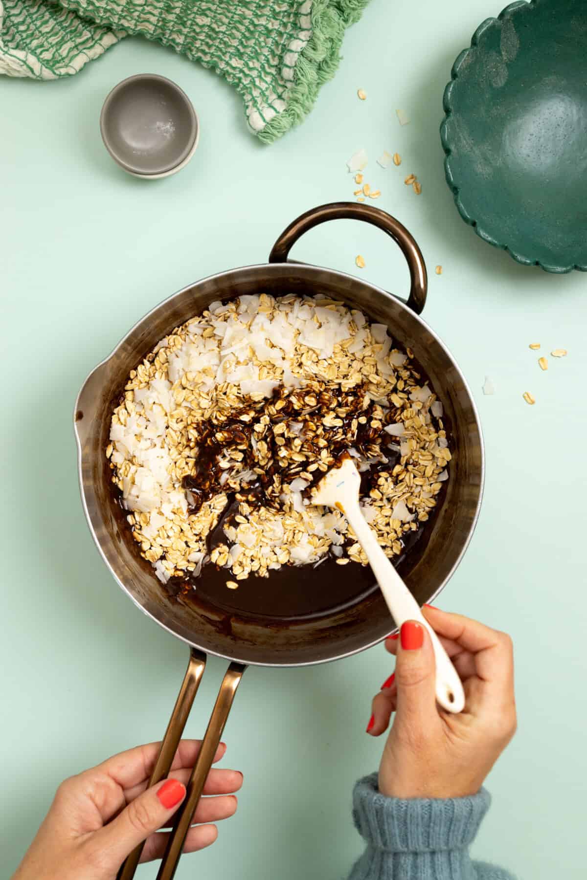 folding in oats and coconut flakes