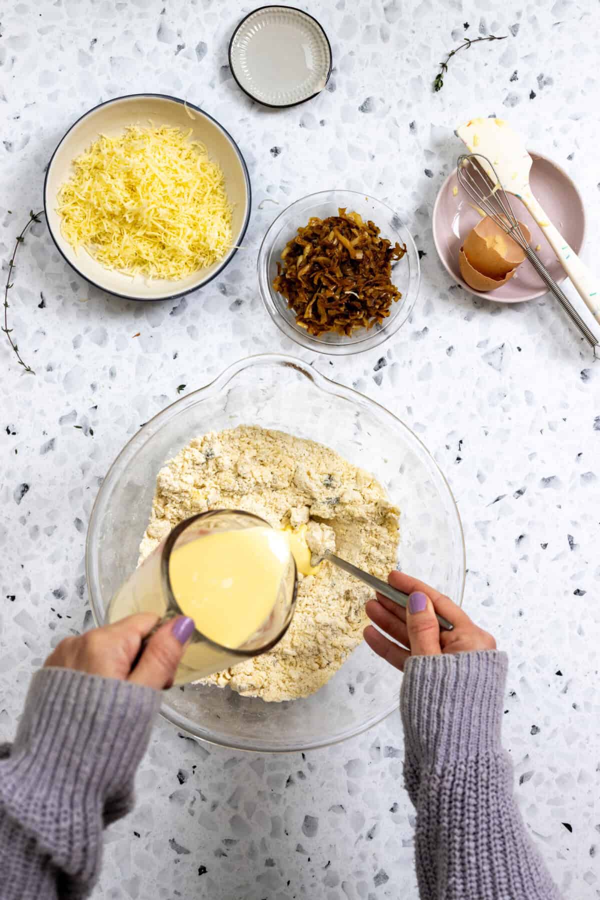 adding milk and egg to French Onion Scone dough
